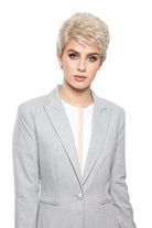 Woman wearing Aubrie synthetic pixie wig by WigPro in color SF23-20-27 wearing a black top against a white background - front view