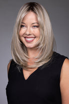 Bailey by Belle Tress mid-length blonde layered synthetic wig with a natural lace front and monofilament top.