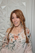 Woman with long wavy red wig (Gaia by Auburn Spice R) braided
