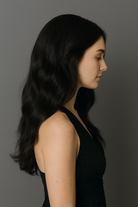 Woman's side profile wearing a black 24 inch wig 