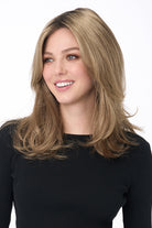 Bobbi by Envy long layered synthetic wig in a warm blonde shade with a natural lace front.