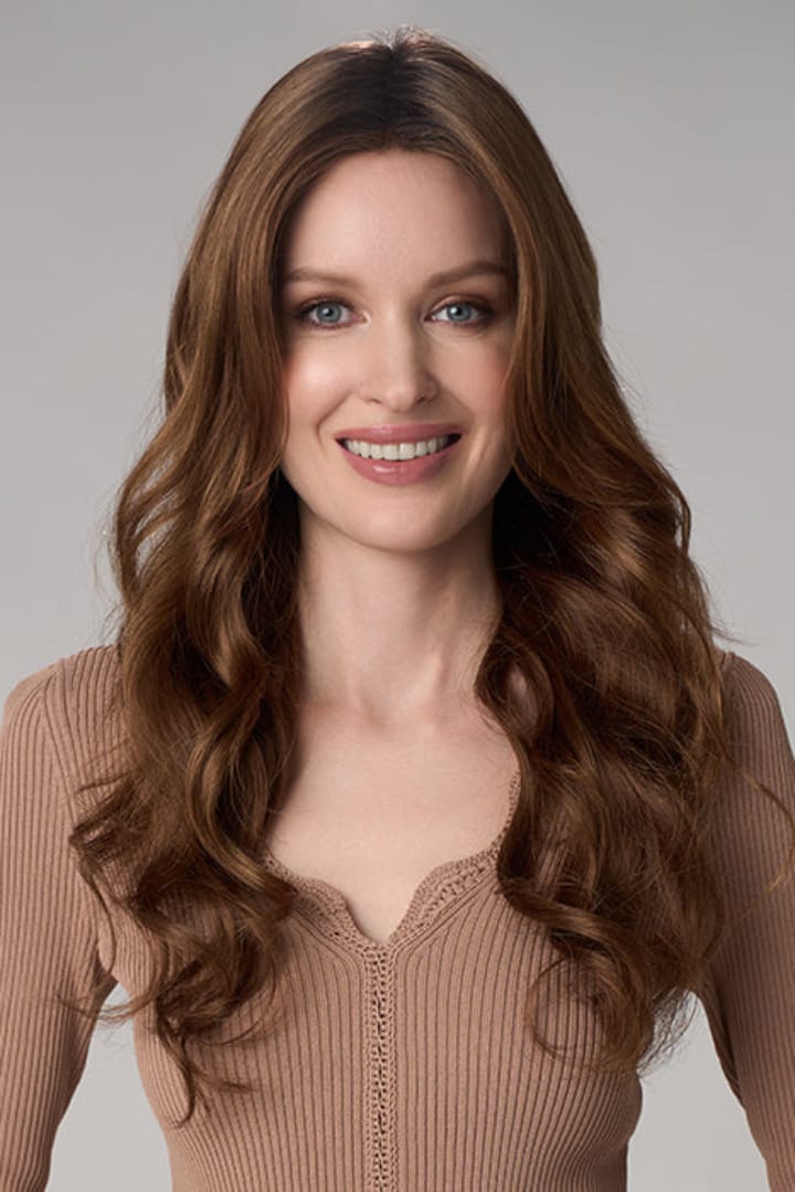 Woman wearing Brianna Hand Tied Wig by Envy in Cinnamon Toffee | Front smiling