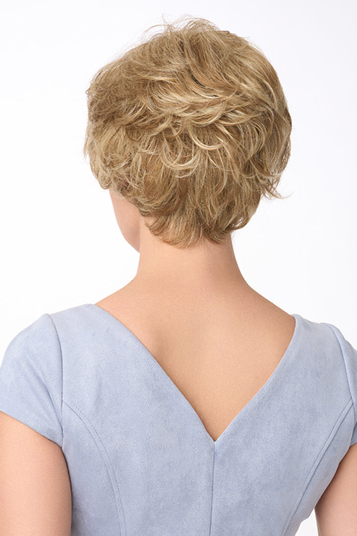 Bryn by Envy short, curly synthetic wig in a light blonde shade, viewed from the back.