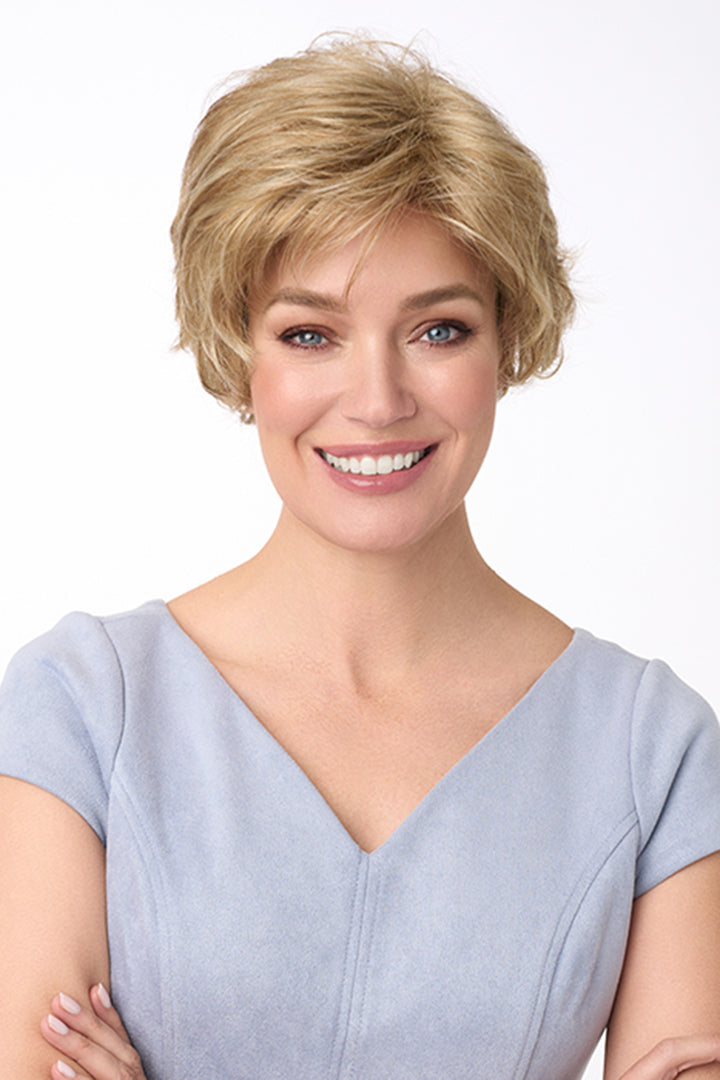 Bryn by Envy, short curly synthetic wig in light blonde with full volume.