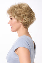 Bryn by Envy short, voluminous synthetic wig in a light blonde, curly, layered style.
