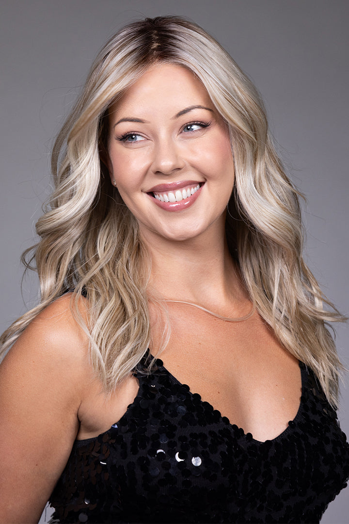 Claudia by Belle Tress long blonde wavy heat-friendly synthetic wig with a natural lace front and monofilament top.