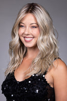 Claudia by Belle Tress long blonde wavy synthetic wig with lace front and monofilament top.