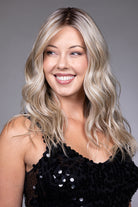 Claudia by Belle Tress long blonde wavy synthetic wig with a natural lace front and monofilament top.