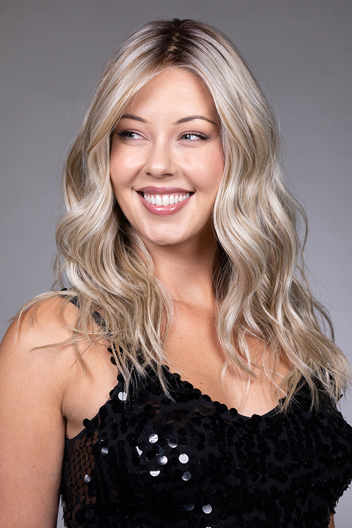 Claudia by Belle Tress long blonde wavy synthetic wig with a natural lace front and monofilament top.