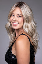 Claudia by Belle Tress long blonde wavy heat-friendly synthetic wig with a natural lace front and monofilament top.