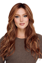 Cali Girl by TressAllure long synthetic wig with beachy waves and face-framing layers in a warm auburn highlighted blend.