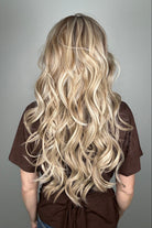 Woman wearing long curly rooted blonde wig (Carolina by Belle Tress in Rootbeer R).