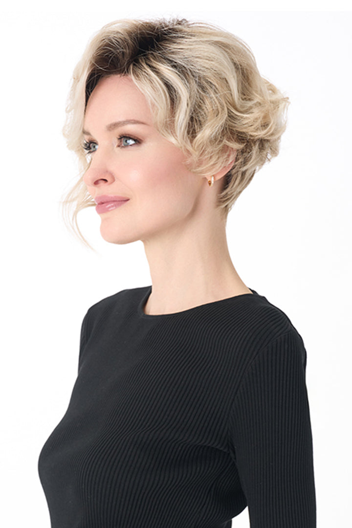 Carrisa by Envy short blonde curly synthetic wig with a lace front and natural monofilament part.