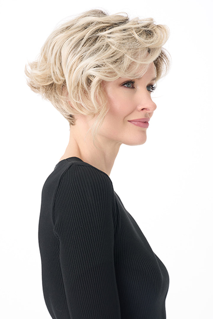 Carrisa by Envy short blonde curly synthetic wig with a lace front and monofilament part.