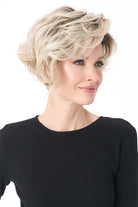 Carrisa by Envy synthetic blonde curly wig with a lace front and tousled, layered volume.