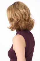 Chloe by Envy synthetic wavy bob wig in a highlighted blonde shade with layered texture and natural movement.
