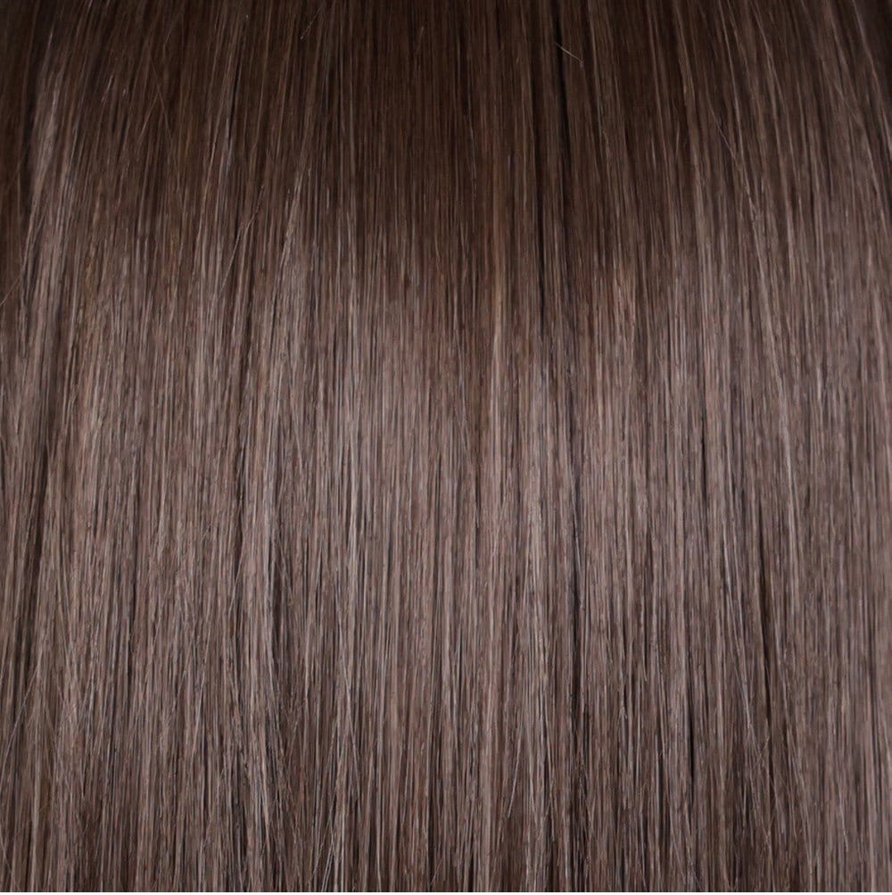 A close-up of Coolest Ash Brown - a rooted brown with a mix of light ash brown, medium brown and subtle dark blonde highlights. 
