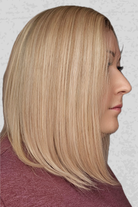Woman with stylish blonde bob wig wearing Eileen by PUSH in color Miel 