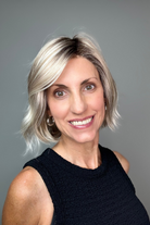 Woman with short blonde bob wig with bangs (Esprit by Ellen Wille in Pearl Blonde R).
