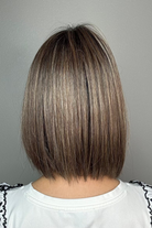 Woman wearing shoulder-length bob with bangs (Miss Comfort by Ellen Wille in Dark Sand R)