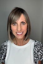 Woman wearing shoulder-length bob with bangs (Miss Comfort by Ellen Wille in Dark Sand R)