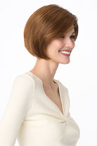 Model wearing a sleek, auburn synthetic bob wig with a natural lace front and monofilament part.