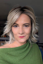 A woman with short blonde layered wig (Farrah by Belle Tress in color Butterbeer-R)