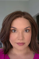 Woman wearing shoulder length wavy bob (Farren by Amore in Ginger Brown).