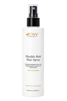 Envy Flexible Hold Hair Spray in a white 8.5 oz bottle with a black spray nozzle and minimalist branding.