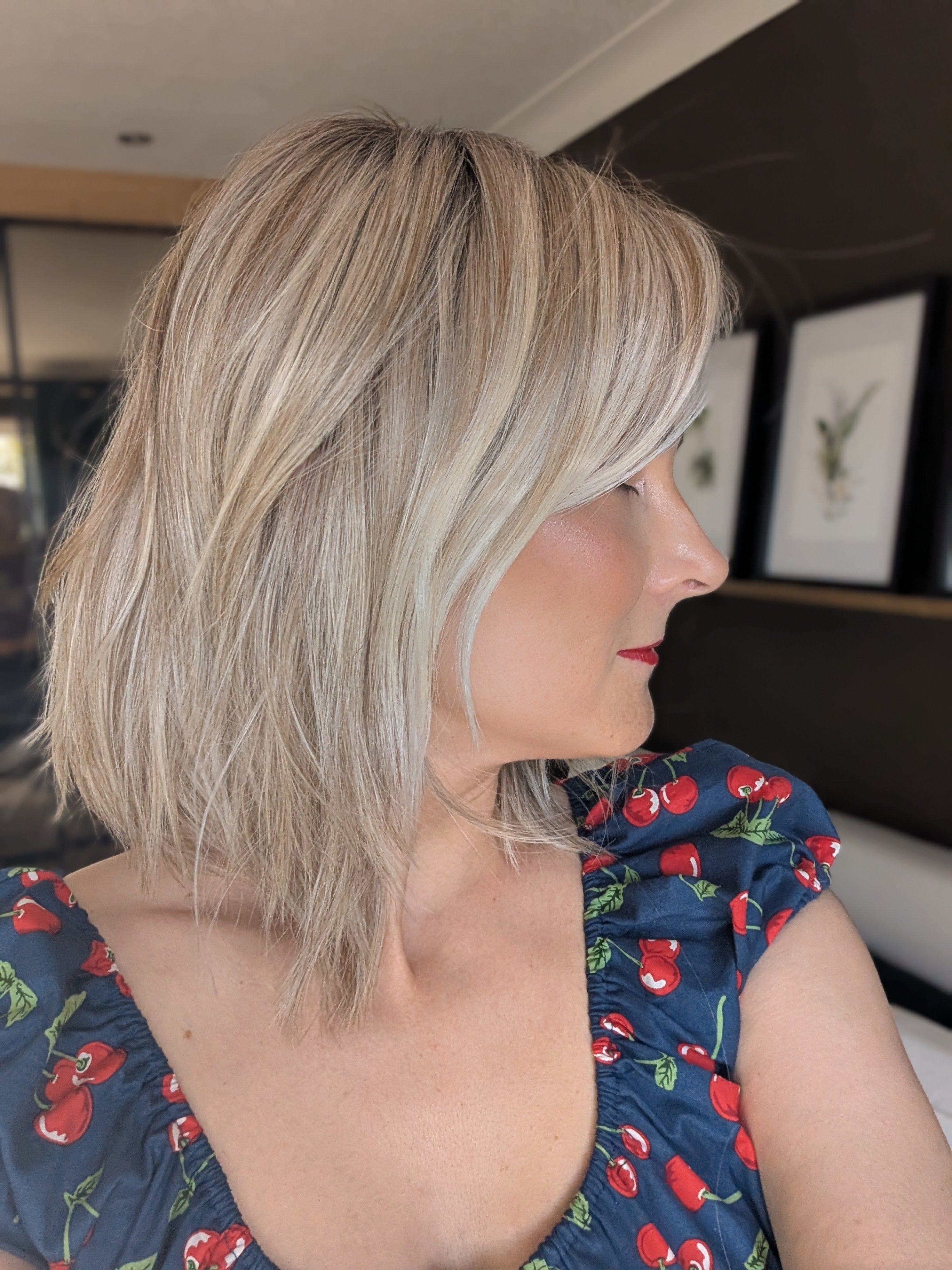 Woman wearing layered shoulder length style wig (Ellen Wille's Flow in Pearl Blonde R)