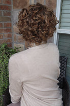 Woman wearing short brunette bob wig (Gabor's Buoyant in color SS Hazelnut) back