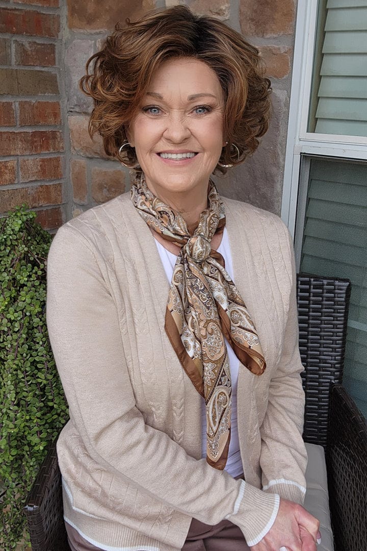 Woman wearing short brunette bob wig (Gabor's Buoyant in color SS Hazelnut)