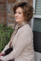 Woman wearing short brunette bob wig (Gabor's Buoyant in color SS Hazelnut) side
