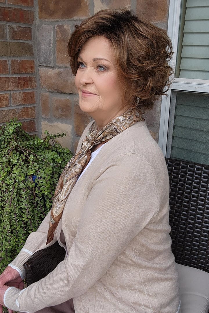 Woman wearing short brunette bob wig (Gabor's Buoyant in color SS Hazelnut) side