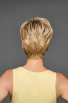 Back view of a short, layered blonde synthetic pixie wig with textured, piece-y styling.