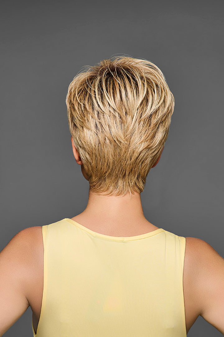 Back view of a short, layered blonde synthetic pixie wig with textured, piece-y styling.