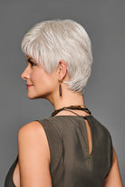 Side profile of a woman wearing a short, textured silver-blonde pixie cut synthetic lace front wig.