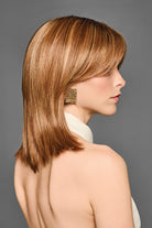 Shoulder-length synthetic bob wig with tapered layers and curtain bangs in a warm auburn highlighted color.