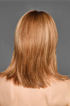 Back view of a shoulder-length synthetic wig with tapered layers in a multi-tonal golden brown highlighted color.