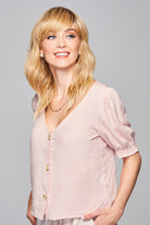 Woman is wearing Aspiration wig by Gabor in SS Light Blonde | Front looking to side