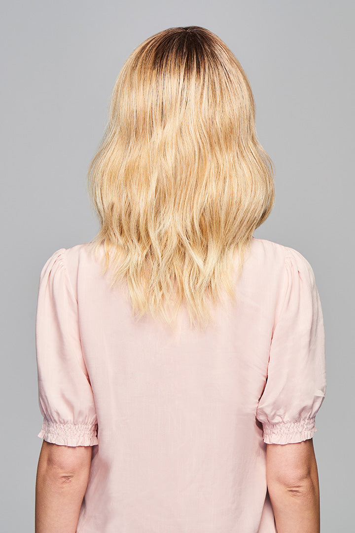 Woman is wearing Aspiration wig by Gabor in SS Light Blonde | Back