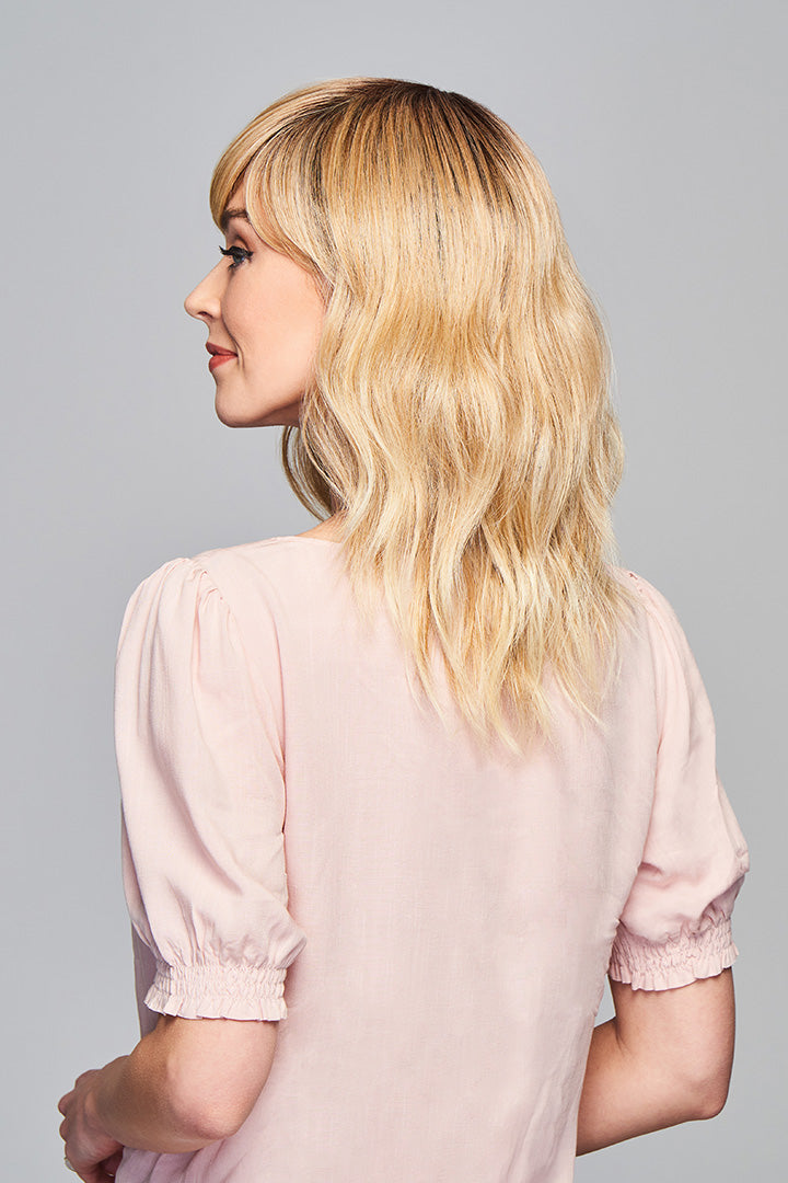 Woman is wearing Aspiration wig by Gabor in SS Light Blonde | Left Side