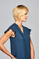 Woman is wearing Enlighten wig by Gabor in SS Medium Blonde | Right Side