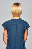 Woman is wearing Enlighten wig by Gabor in SS Medium Blonde | Back