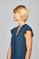 Woman is wearing Enlighten wig by Gabor in SS Medium Blonde | Left Side
