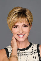 Woman wearing Graceful Touch wig by Gabor in SS Medium Blonde | Front hand resting in side of neck