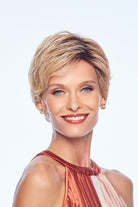 Woman wearing Wonder wig by Gabor in SS Light Blonde | Front looking over shoulder