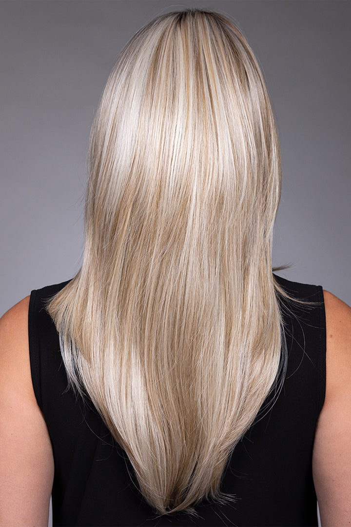 Back view of Gigi by Belle Tress, a long, layered blonde synthetic wig with a sleek, smooth finish.