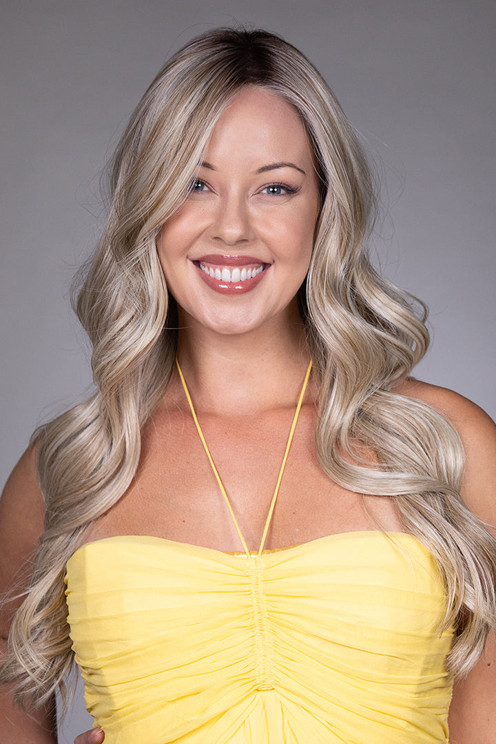 Gisele by Belle Tress long blonde wavy synthetic wig with a natural lace front and monofilament top.