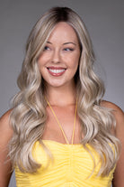 Gisele by Belle Tress long blonde wavy synthetic wig with a natural lace front and monofilament top.